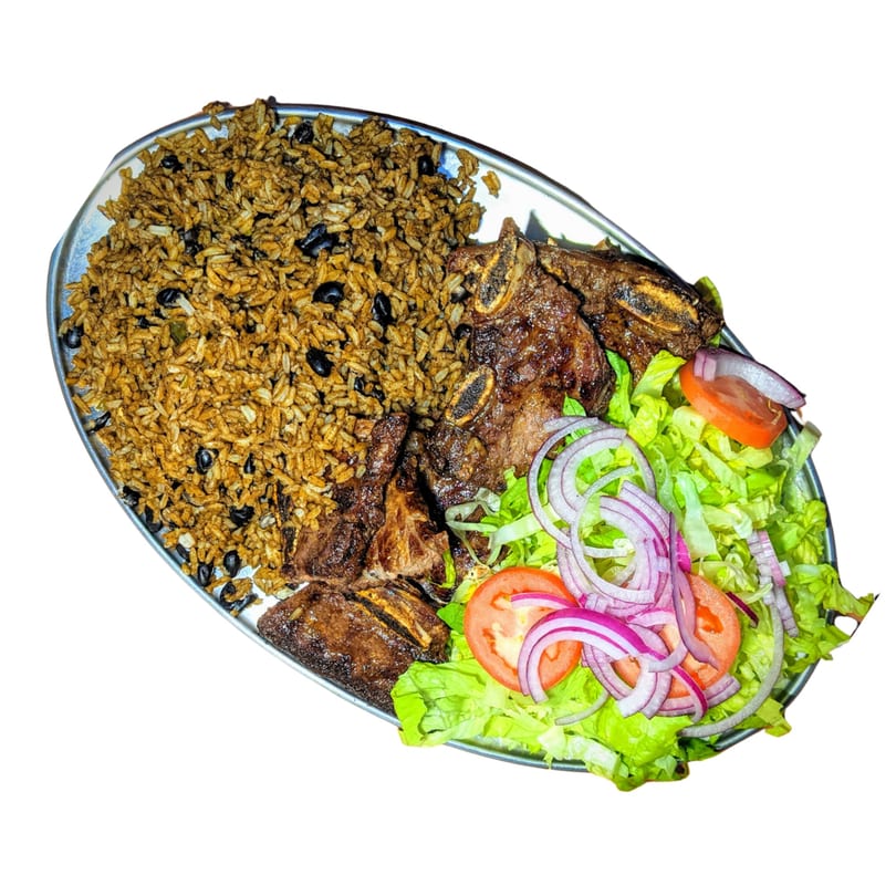 Riva's BBQ short ribs with rice, black beans, and a side salad with red onions and tomatoes.